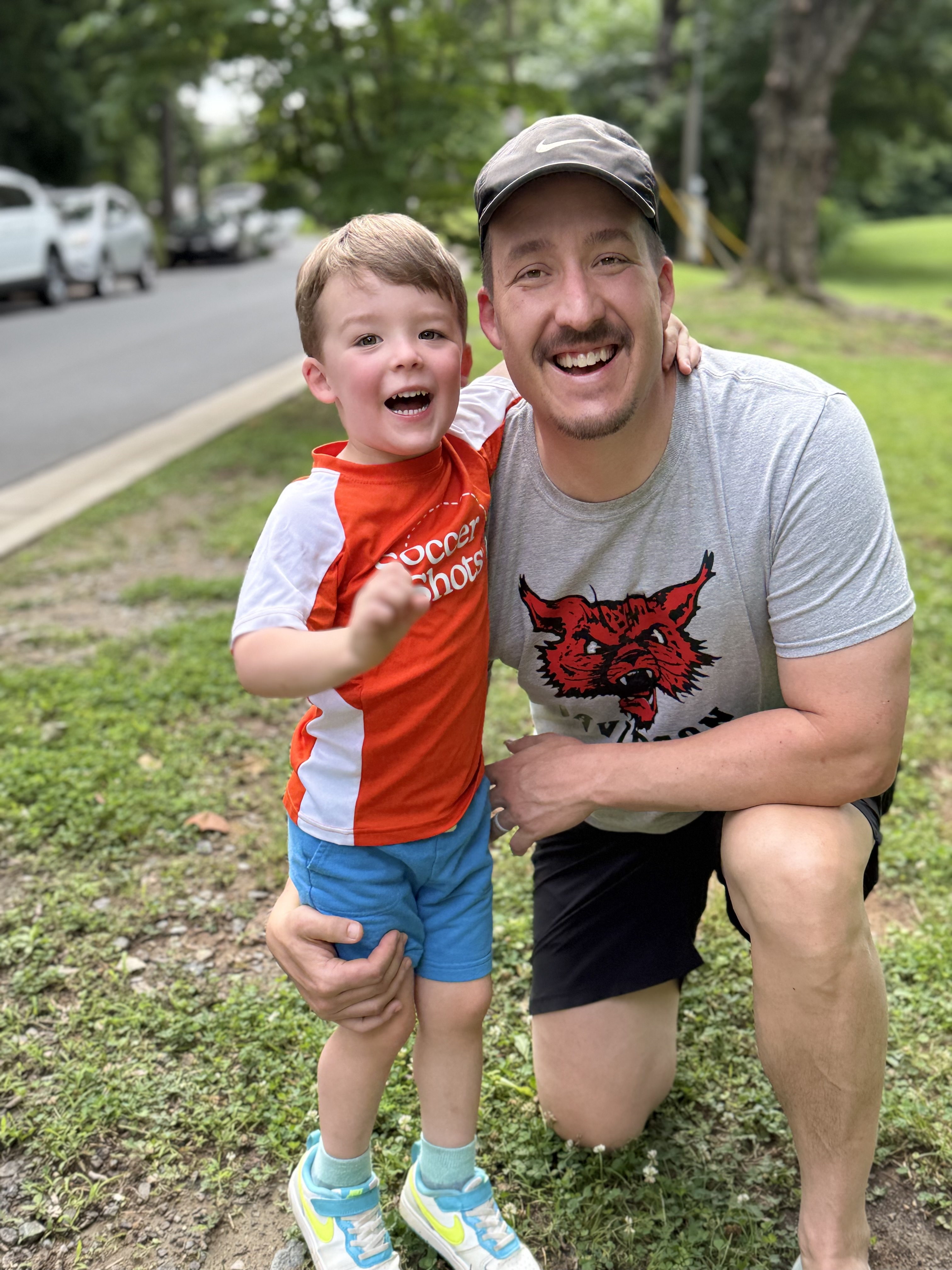 Father posing for a picture with his son.